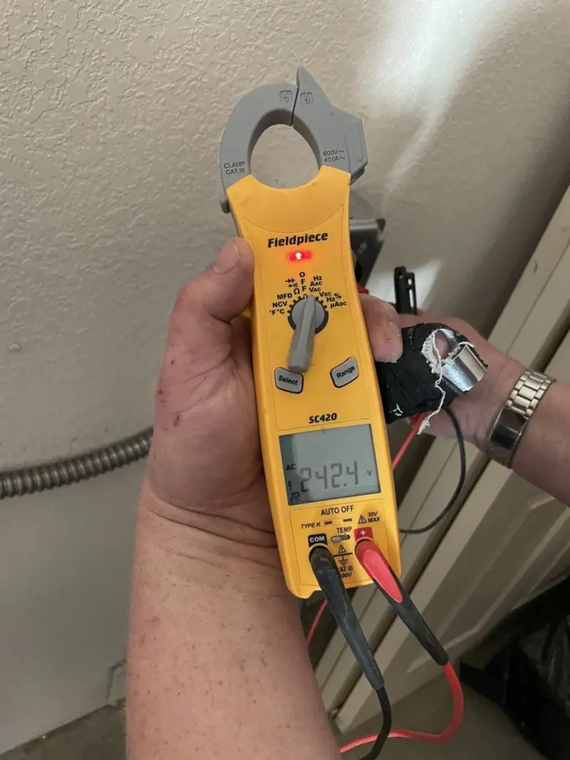 Voltage testing with clamp meter during Electrical Installation Services in St. James City